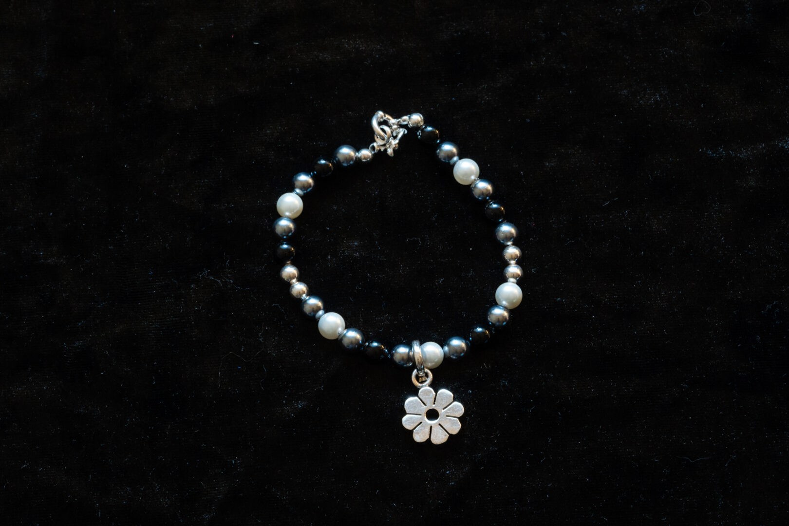 Black and White Bead Bracelet with Sterling Silver Flower