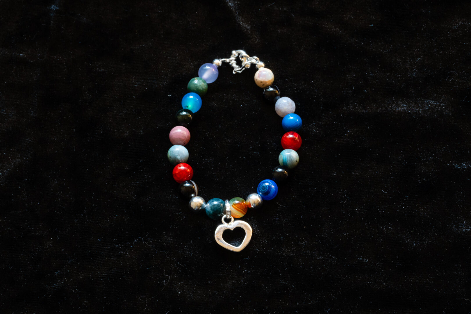 A Multi Color Bead Bracelet with Sterling Silver Heart