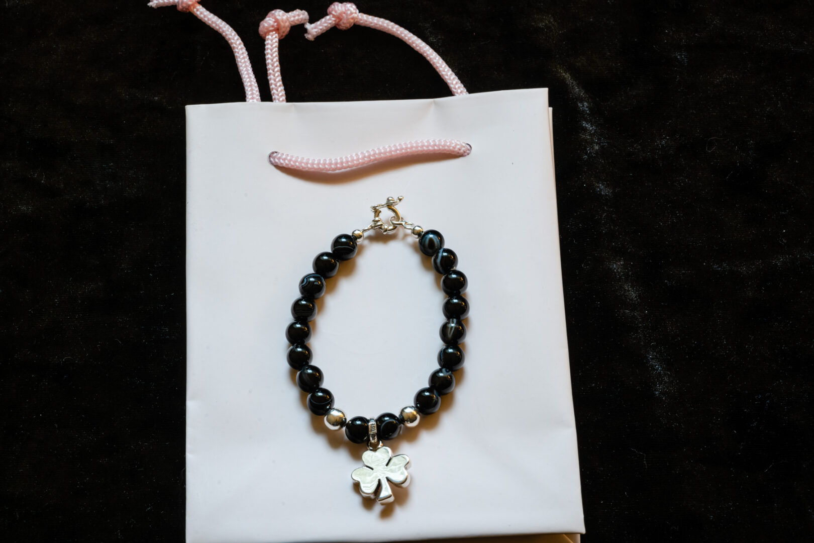 A Black Bead Bracelet with Sterling Silver Clover