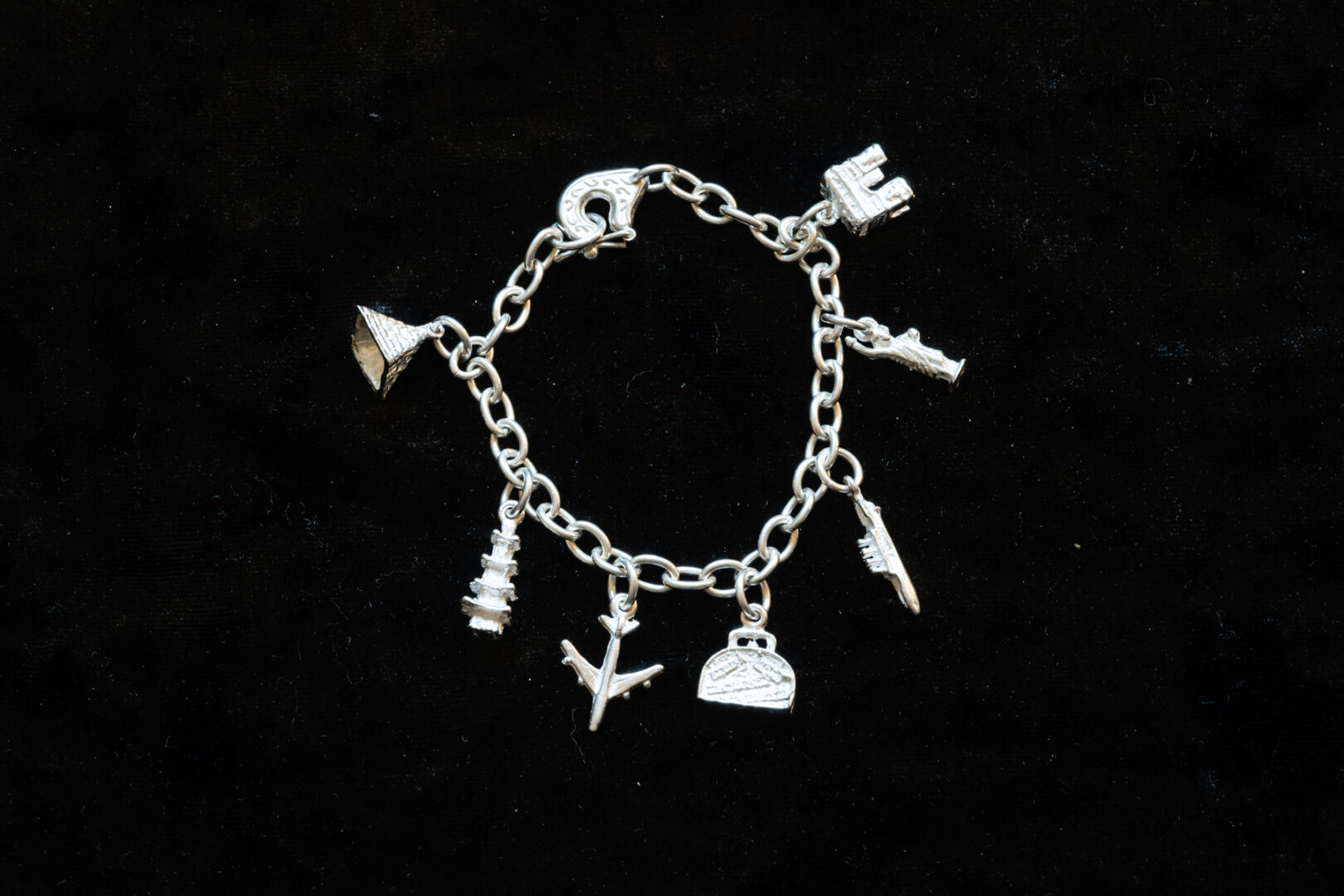 Sterling Silver Bracelet with Stones, Airplane, and more