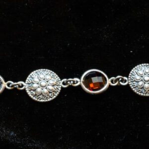 A bracelet with different color stones