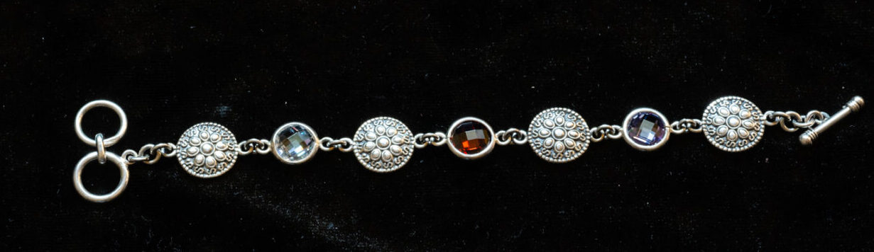 A bracelet with different color stones