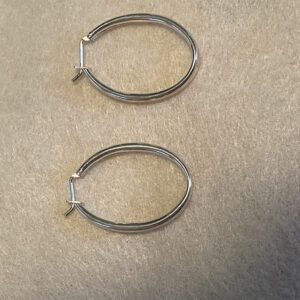 A simple round shaped earring made out of silver